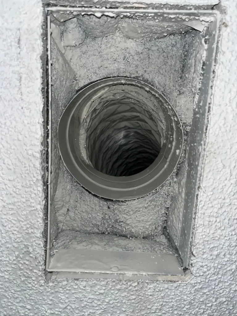 Freshly cleaned ceiling supply duct and boot after professional air duct cleaning on the Treasure Coast