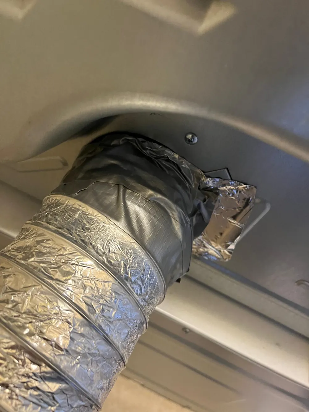 Dryer transition duct sealed and reconnected after vent cleaning in Port St. Lucie FL