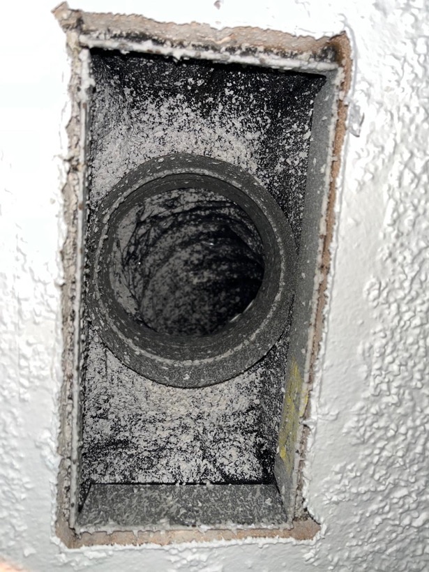 Air duct register coated with dust before SunDuct cleaning
